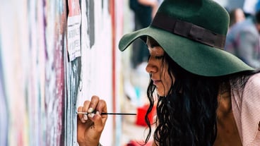 Woman Painting on a Wall Photo