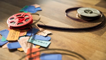 Cinema concept with reel and tickets
