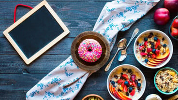 Healthy breakfast with milkmuesli and fruit on a wooden background.