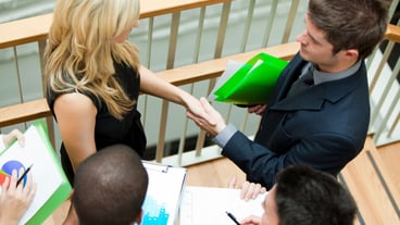 Business team discussing about reports and documents on stairs