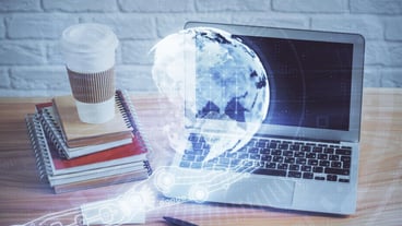 Multi exposure of table with computer and world map hologram International data network concept