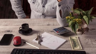 Businessman working in the office with laptop and documents on the table