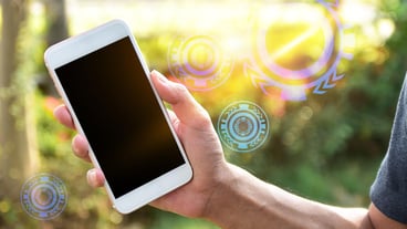 Digital composite image of man using smart phone outdoors