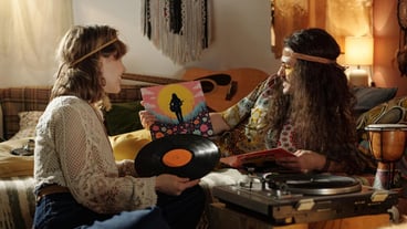 Enjoying vinyl records and relaxing in cozy room