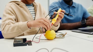 Close up of teenage girl working on science experiment in school classroom, copy space