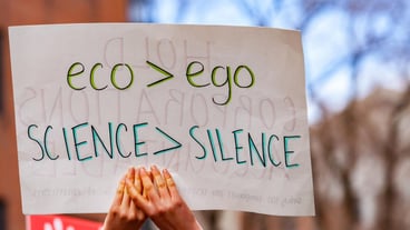 Lower part of a woman with text on paper
