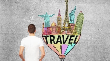Man looking at travel sketch