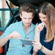Beautiful young lovers using a tablet