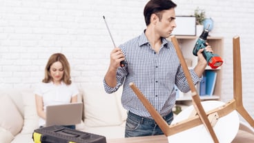 The man handyman is engaged in assembling the chair.