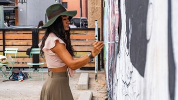 Woman Painting on Wall Photo