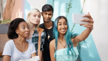 Cheerful friends taking selfie