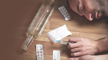 Unconscious drug addict man lying on floor