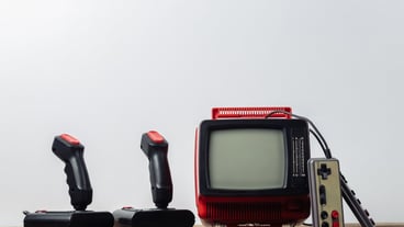 Retrogaming. Video game competition. Old TV with joysticks and gamepads on white background. Attributes 80s