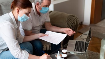 Medium shot people wearing masks indoors