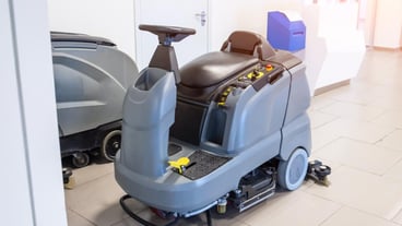 Floor care and cleaning services with professional washing machine on the charger machine inside public building