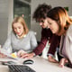 people and corporate concept - happy business team with papers meeting in office
