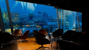 Bangkok city view point from Lounge interior overlooking a magnificent cityscape blue sky
