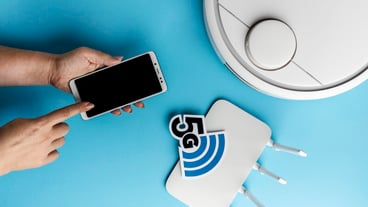 Top view of wi-fi router with smartphone and vacuum cleaner