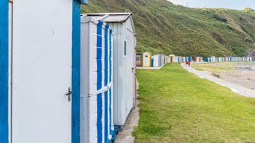 Colorful huts on a beach in Luarca Spain