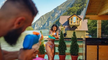 Couple having a water fight with squirt guns