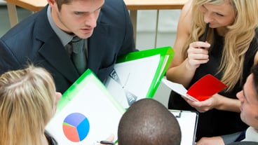 High angle of young business team having a meeting on stairs