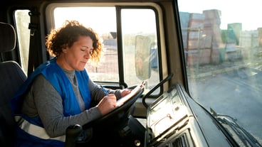 Professional female driver with van or wagon car