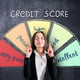 Bank loan cocnept with young woman with closed eyes and crossing fingers on credit score scale on chalkboard background
