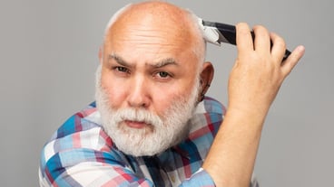 Gray man hair clippings Bald man hairclipper Mature baldness and hair loss concept