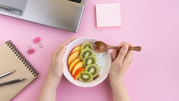 Woman eating food in the workplace