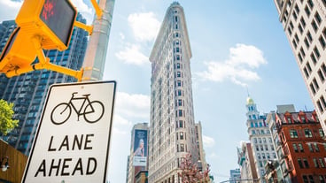 Low angle view of road sign against buildings