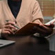Cropped image of female real estate agent working with laptop at office Mortgage and real estate investment concept