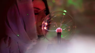 Close-up of a woman holding bubbles