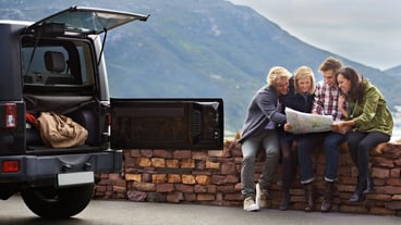 Friends map and car road trip on mountain for nature adventure or search for location countryside or journey Men women and holiday in Italy with transportation for vacation explore or travel