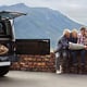 Friends map and car road trip on mountain for nature adventure or search for location countryside or journey Men women and holiday in Italy with transportation for vacation explore or travel