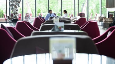 Happy business colleagues in modern office. Team of successful business people having a meeting in executive. Couple in modern cafe enjoying time together