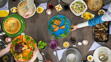 Overhead view of family and friends eating food at the table