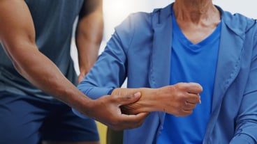 Hands physiotherapy and recovery with a patient training while listening to her therapist for rehabilitation Healthcare fitness or exercise with a person and physiotherapist during a workout