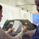 Car showroom agent providing customer with color wheel tinting selection