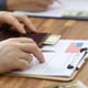 Male hands in suit lie on application for usa visa
