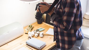 Woman using camera to make photo diy