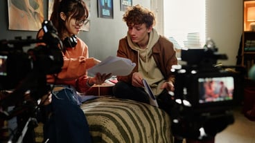Collaborating on Creative Film Project in Cozy Room