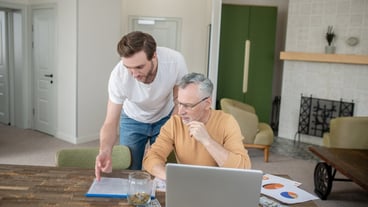 Project work. Two men working together on a project and looking interested