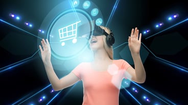 Technology, virtual reality, cyberspace and people concept - happy young woman with virtual reality headset or 3d glasses looking at shopping cart icon over black background and lights