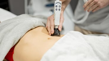 Applying vacuum roller massage for womans abdomen