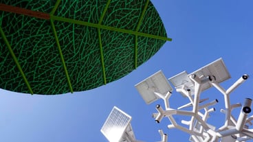Low angle view of traditional windmill against clear blue sky