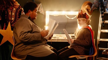 Performing rehearsing scene in theatre dressing room