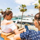 Girlfriends holding mobile phone