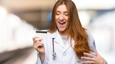 Redhead woman with a credit card caught in the hospital
