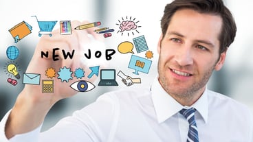 Business man with marker behind job doodles and flare in blurry grey office