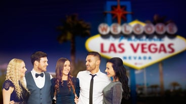 friends in party clothes hugging at las vegas